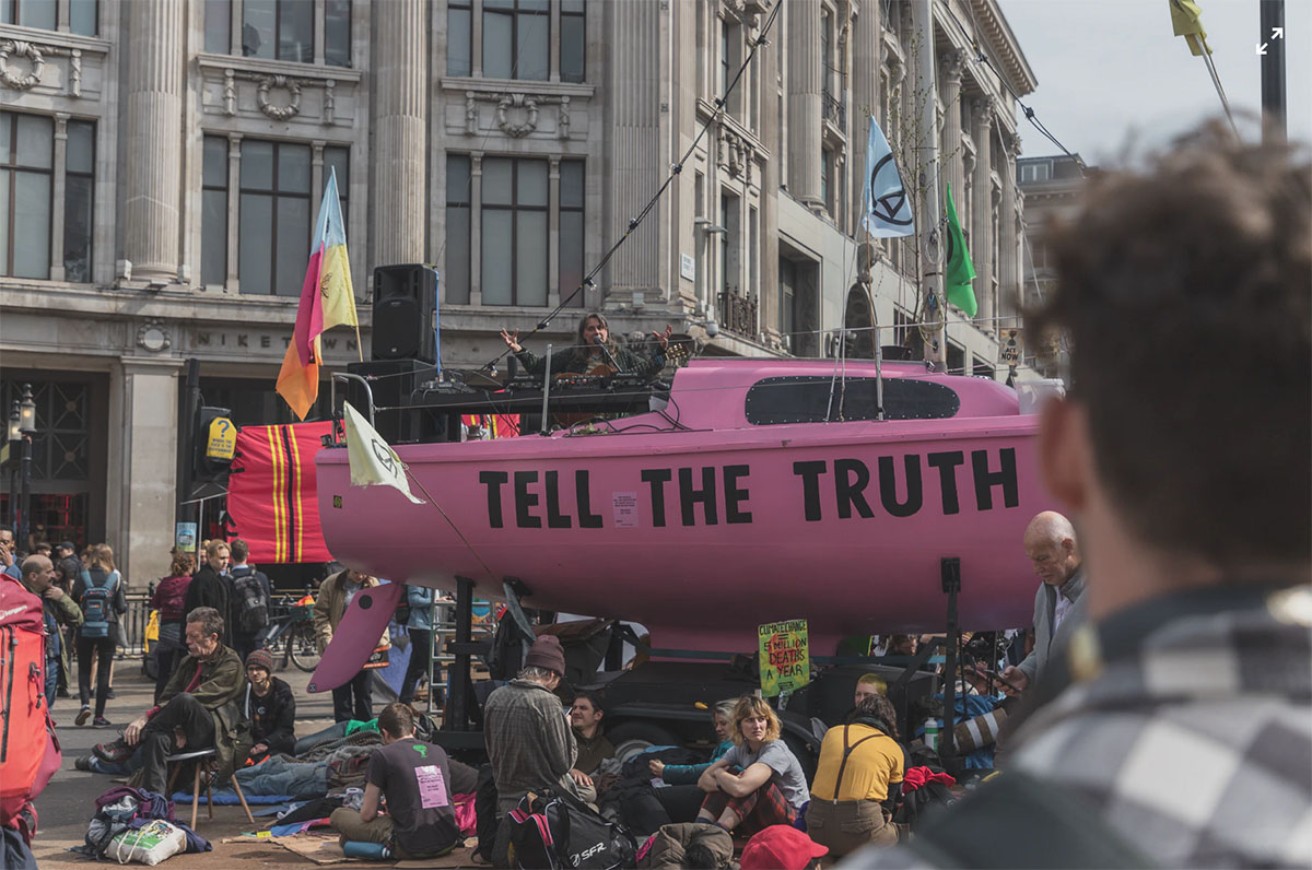 Pink boat with ‘tell the truth’ painted on it