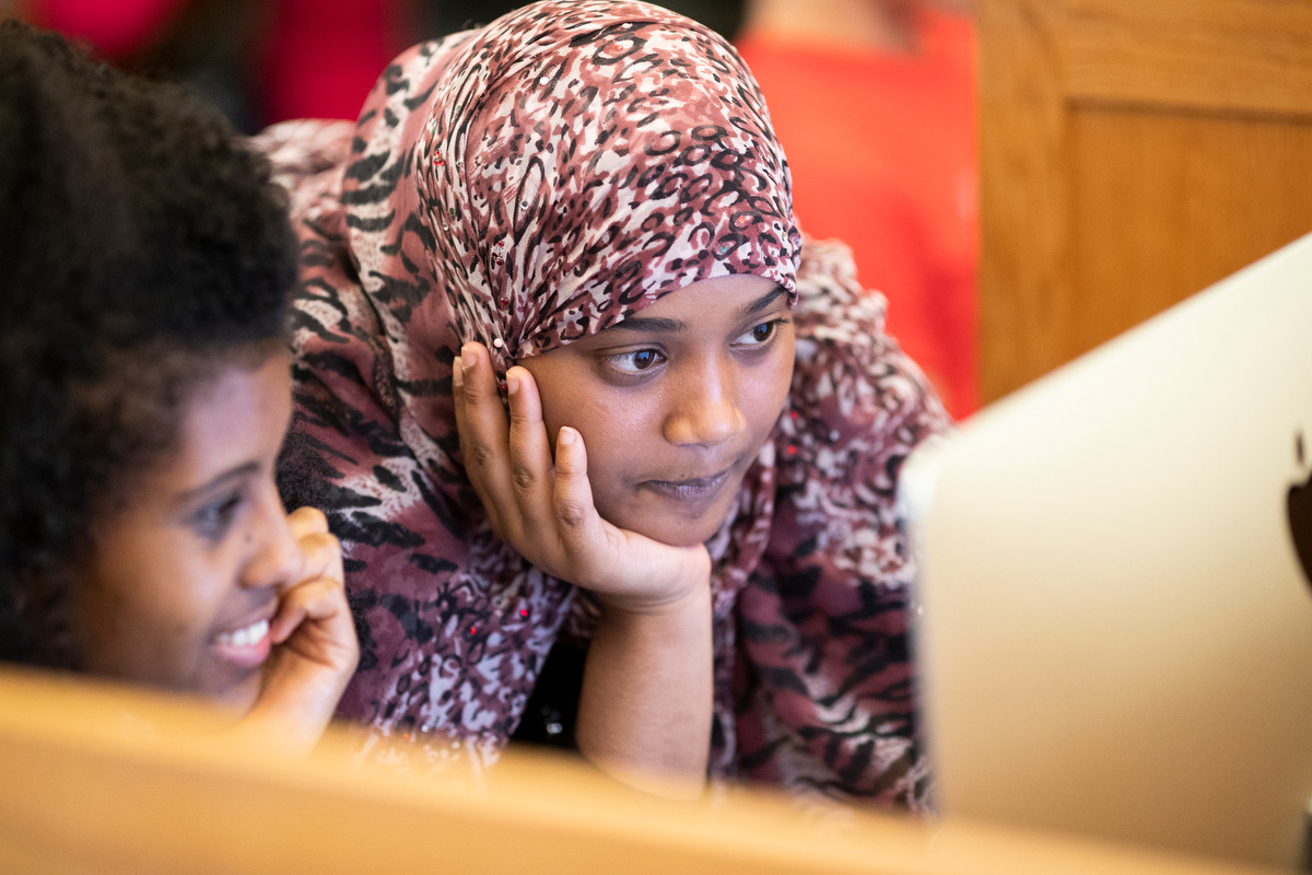 two girls looking at laptop screen